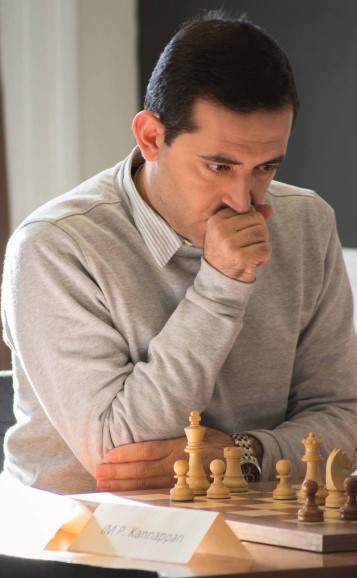 Andranik Matikozyan thinking over a position at a tournament board